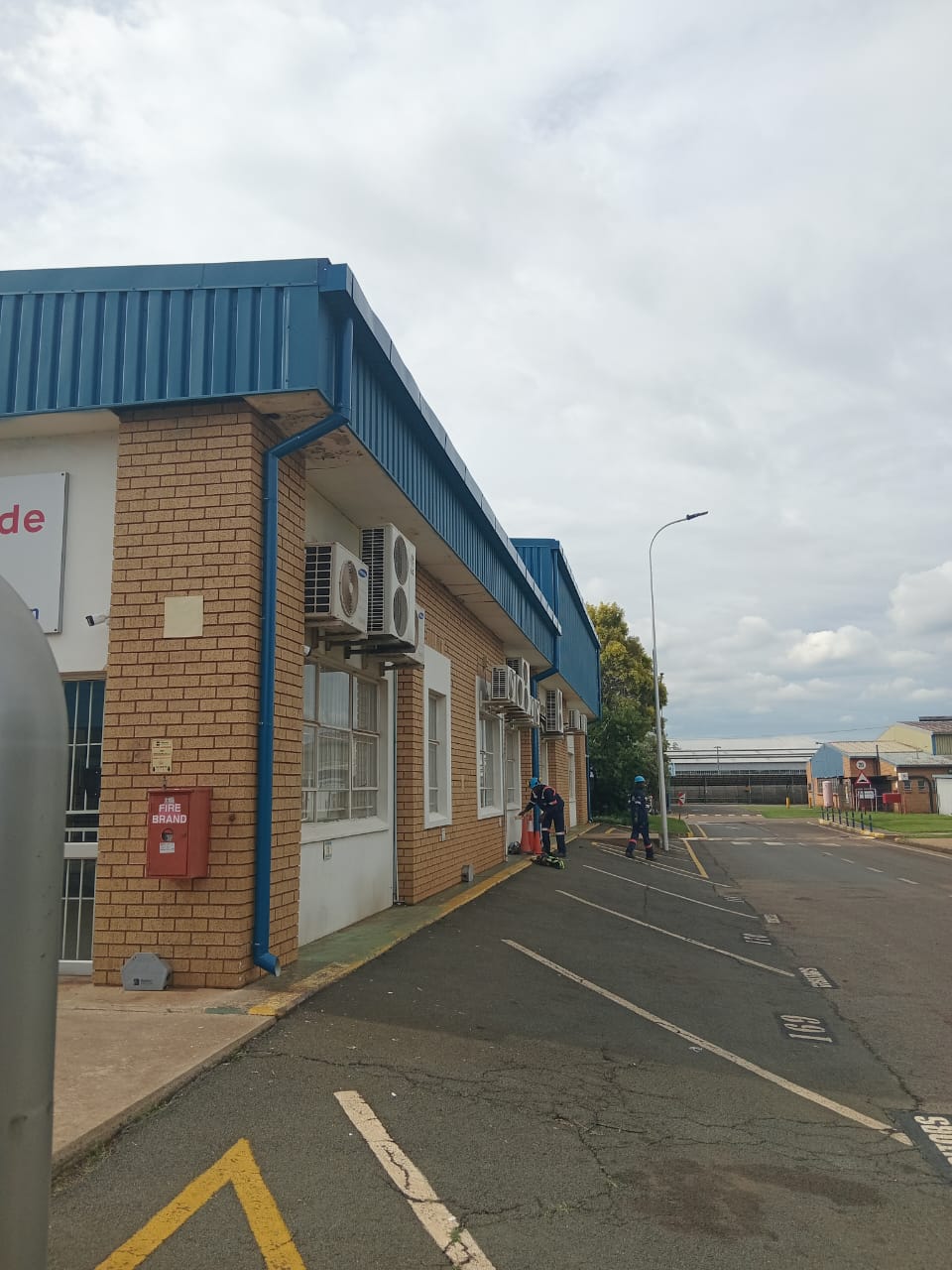 Industrial building with blue roof facade